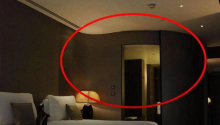 Why do you need to turn on the bathroom light when sleeping in a motel or hotel?